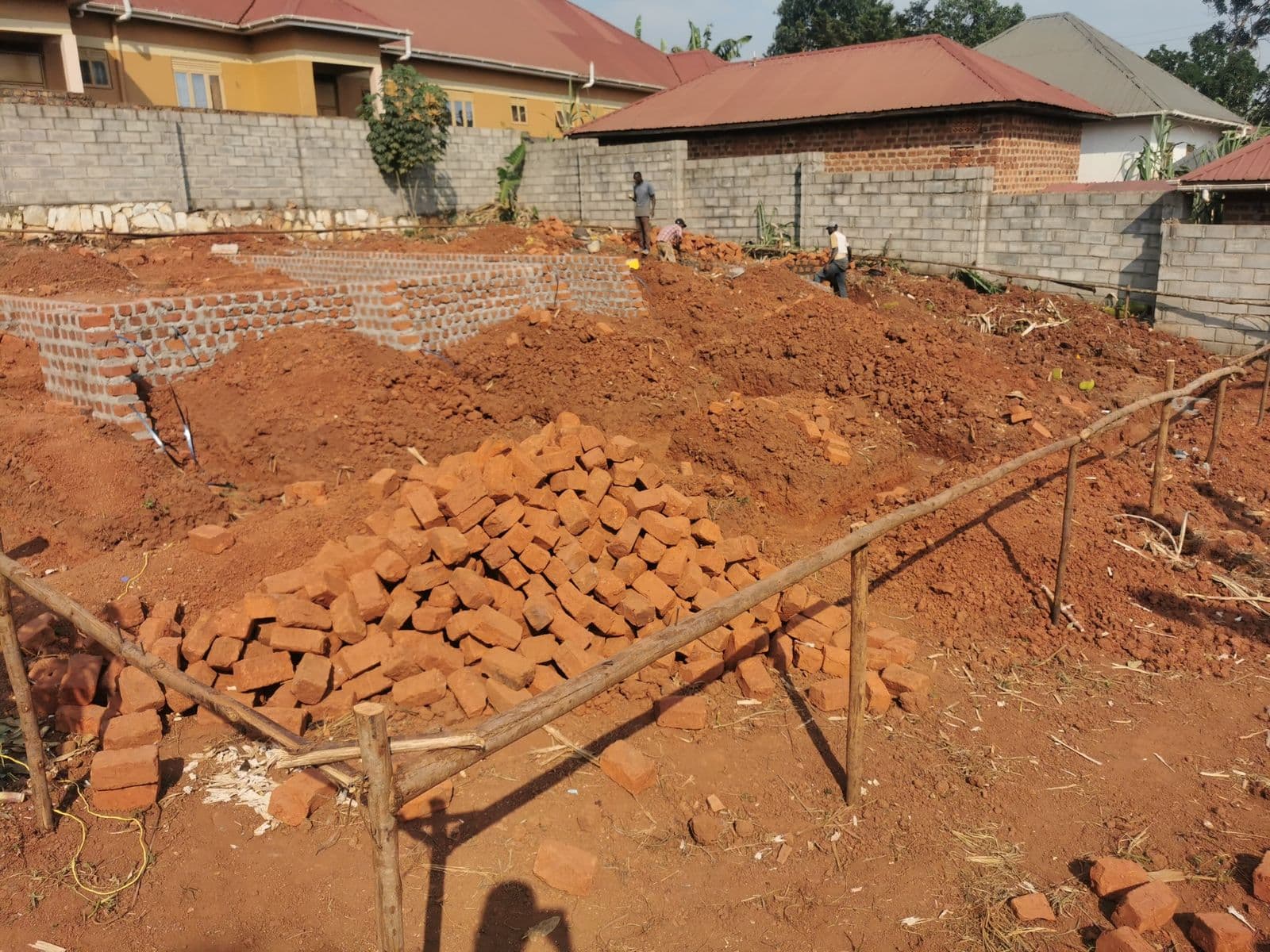 Foundation setting-out with stockpiled bricks on site