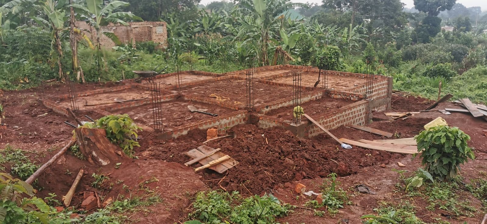 Foundation walls and reinforcement columns laid out on site