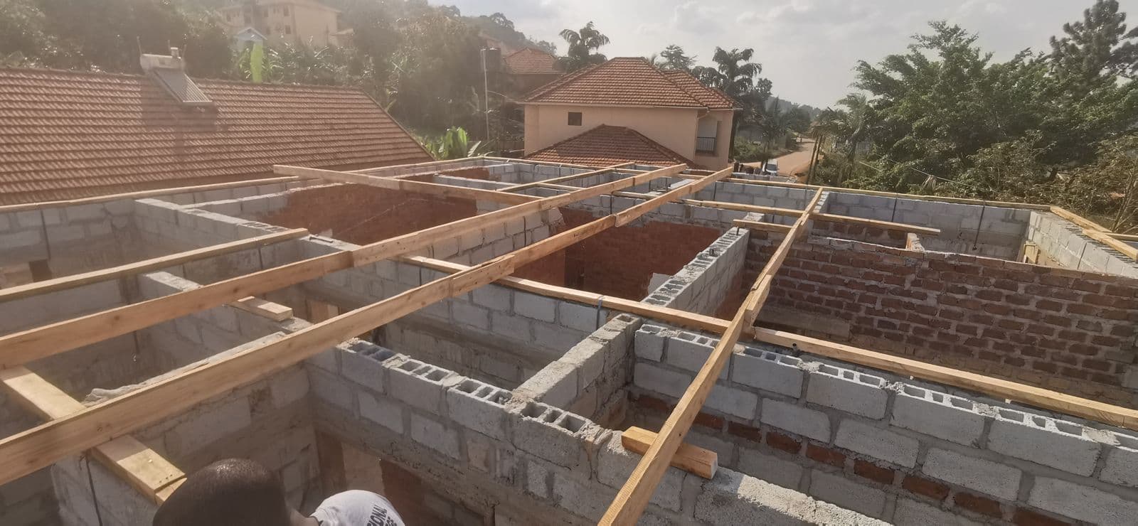 Roof carpentry and timber trussing on a hillside site overlooking the city